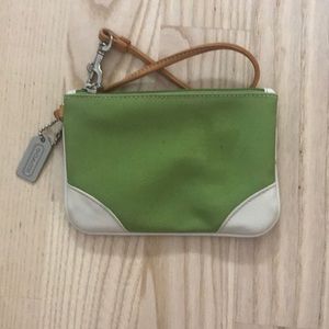 Green and white Coach wristlet.